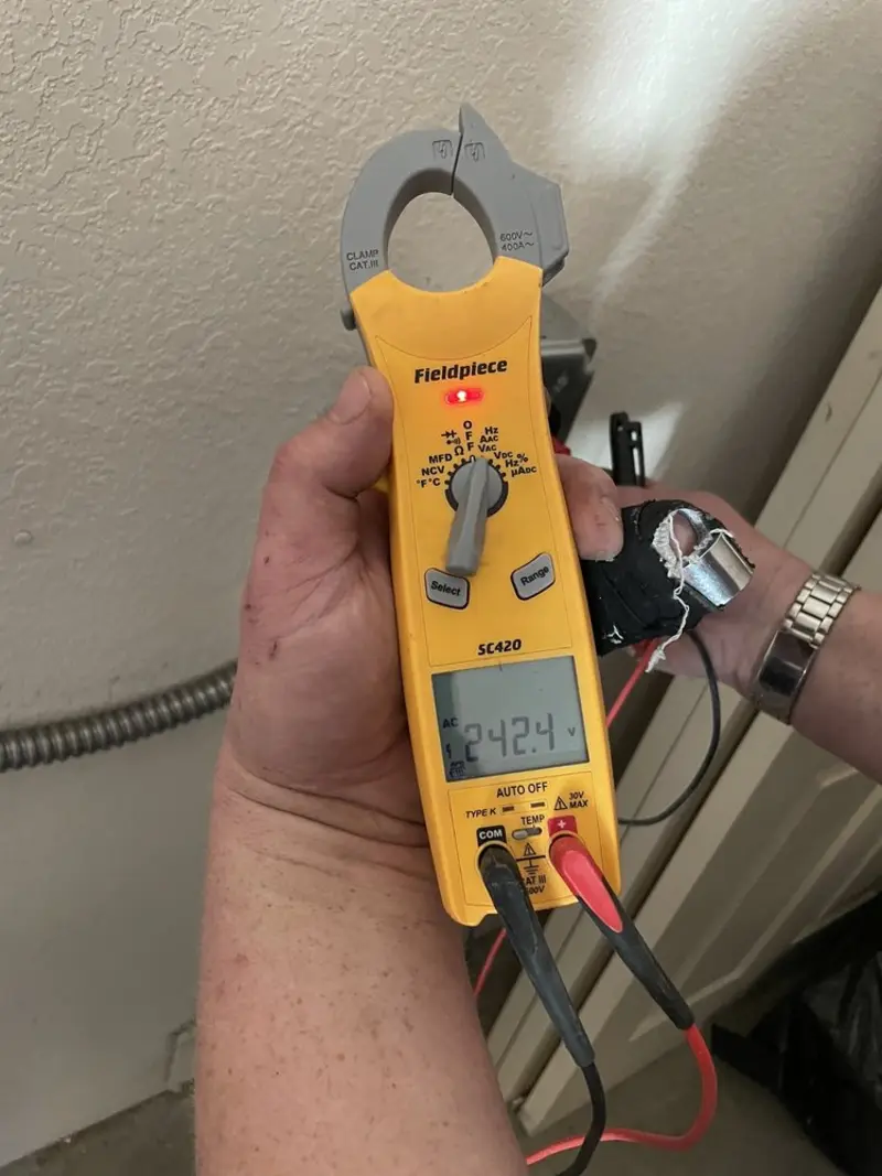 Voltage testing with clamp meter during Outlet Installation in Ironton